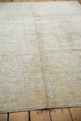 Light, airy distressed texture of an antique Kaisary rug with subtle floral design.
