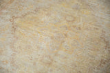 Super soft, evenly distressed pile of antique Turkish Kaisary rug, faded gold and beige floral patterns.