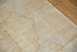 Soft, airy distressed pile with light gold, platinum, and pale orange floral patterns.