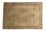 Faded Vintage Oushak carpet with expressive antique ivory and bronze central medallion, 5'8