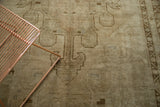 Faded bronze, beige medallion and arrow motif on hand knotted vintage Oushak.