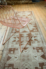 Geometric bronze and ivory pattern of the vintage Oushak runner.