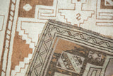 Hand-knotted vintage Oushak runner detail with geometric patterns in ivory, bronze, and platinum.