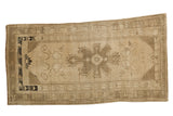 Vintage Oushak runner with central tendril medallion, rustic beige and charcoal palette, 3'2