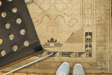 Vintage Oushak rug runner section with beige and charcoal tendrils, showing irregular weave.