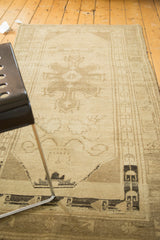 Oushak runner with central floral medallion and village-style irregular weave.