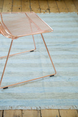 Pale sky blue and charcoal striped Dhurrie rug with hand woven texture and fringe.
