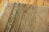 Plush pile detail of a vintage Gabbeh rug, showcasing bronze and brown abrash.
