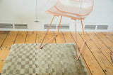 Faded vintage Gabbeh rug with whimsical asymmetrical checkered pattern in pale green and grey.