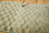 Whimsical asymmetric checkered pattern and plush pile of the vintage Gabbeh rug.