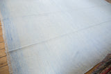 Hand woven Dhurrie carpet with pale blue and ivory minimalist flatweave, fringed edge.