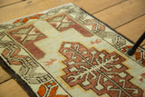 Vintage Oushak runner detail: geometric border with madder red, saffron, and pale sea foam.