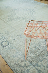 Decorative distressed pattern and soft grey, blue, and ivory tones of the Oushak rug.