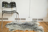 Luxurious Hand Pelt Turkish angora rug with soft grey and charcoal texture.