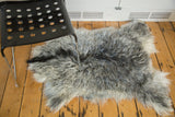 Detail of the incredibly soft angora pelt with mixed ivory, grey, and charcoal fur.