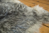 Soft, luxurious texture of a Hand Pelt Turkish Angora rug in grey, charcoal, and ivory.