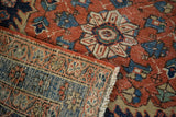 Distressed red pile and blue striped hand-knotted Heriz rug foundation.