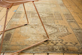 Vintage Oushak rug border with geometric crab motif, abrash, and time-softened copper tones.