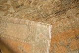 Distressed copper and brown pile texture with hand-knotted beige foundation of Oushak rug.