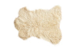 Luxurious ivory Angora skin rug with soft curly texture, 2'1