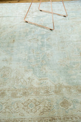 Vintage Distressed Oushak carpet with pale mint, ivory, and beige geometric patterns.