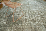 Distressed vintage Tabriz carpet, faded Joshegan design, exposed foundation, cotton white and charcoal.