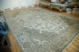 Distressed vintage Tabriz rug with Joshegan design and white exposed foundation.