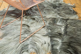 Soft angora skin rug displaying blended silver, grey, charcoal, and black tones.