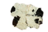 Soft Angora skin rug with ivory, jet black, and bronze cowhide-like pattern, 4' x 5'2