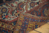 Worn red and blue pile, tattered fringe, and geometric border of an antique Qashqai rug.
