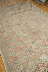 Turkish Jijim carpet detail: geometric diamonds and soft brick red, sea foam green, grey colors.