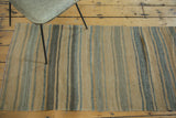 Distressed Turkish Kilim runner with horizontal stripes of apricot beige, platinum, and slate.