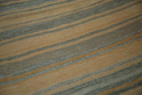 Horizontal striped pattern of a vintage Turkish kilim rug in apricot and slate.