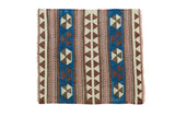 Geometric Turkish Kilim rug with pinwheel and triangular designs in brilliant blue, ivory, chocolate brown, blush.