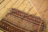 Vintage Kilim rug mat's serpent border detail with geometric patterns and fringe.