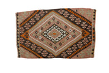 Vintage Turkish Kilim rug with geometric diamond pattern in plum, brown, and ivory.