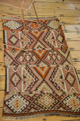 Geometric paneled detail on the hand-woven vintage Kilim runner in blush, beige, and charcoal.