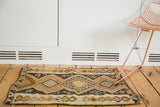 Hand woven Turkish Kilim rug mat with geometric diamond motifs, irregular weave.