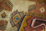 Hand woven Turkish kilim detail: sand, brown, blush pink, blue geometric motif.