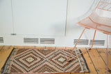 Vintage Turkish geometric kilim rug with concentric diamond medallions in peach and brown.