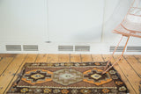 Hand woven Turkish Kilim rug with geometric stepped medallions in chocolate, tangerine, and saffron.