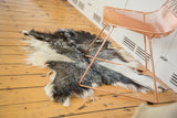 Soft Turkish Angora pelt rug displaying ivory, silver, and grey texture.