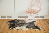Luxurious angora skin rug featuring natural ivory, silver, grey, and charcoal black tones.