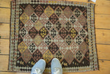 Vintage Turkish Kilim rug, allover geometric diamond motif in earthen green, brown, ivory, and mauve.