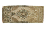 Vintage Turkish Oushak runner, central stepped medallion, zigzag border, sand and brown tones.