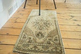 Hand-knotted Turkish Oushak runner with geometric zigzag border in beige and brown.