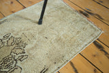 Hand-knotted pile and secured side of a vintage Oushak rug runner.