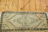 Vintage Oushak runner with stepped lozenge medallion, geometric corners, in blush and celadon.