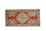 Distressed vintage Turkish Oushak rug runner, cherry red field with stepped ivory medallion. 1'8