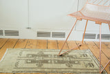 Geometric renderings and beige abrash on a hand-knotted Turkish Oushak runner.